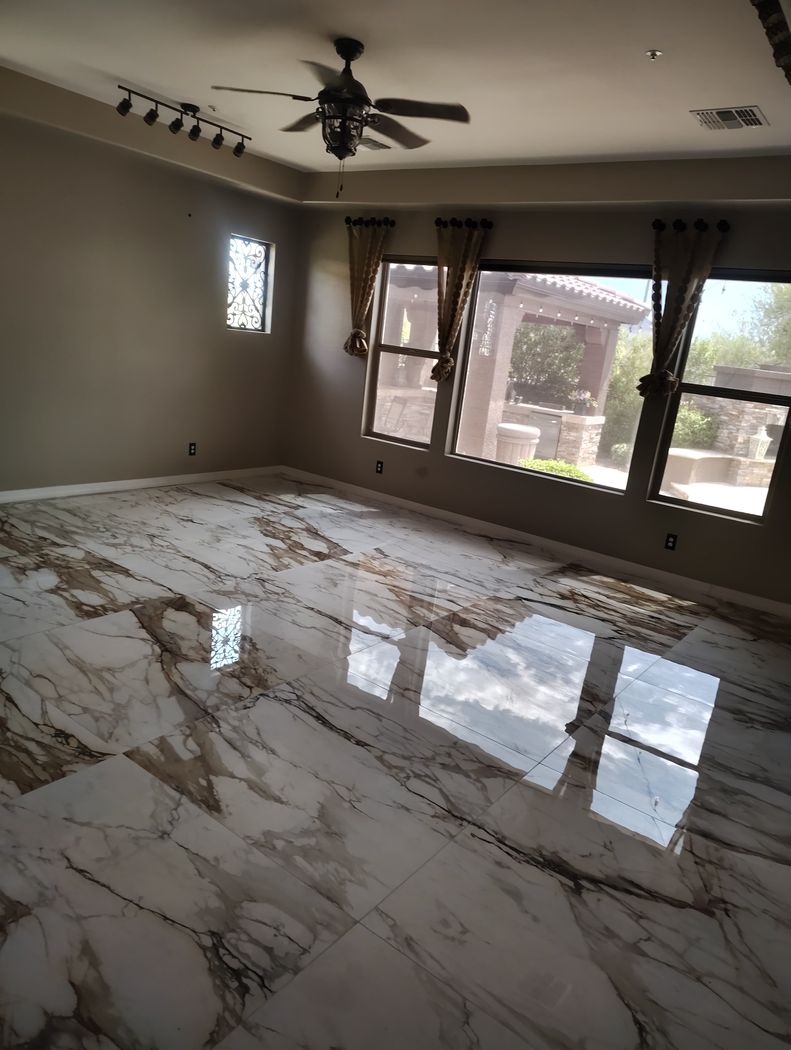 Polished marble-look porcelain floor tiles laid in a Phoenix home